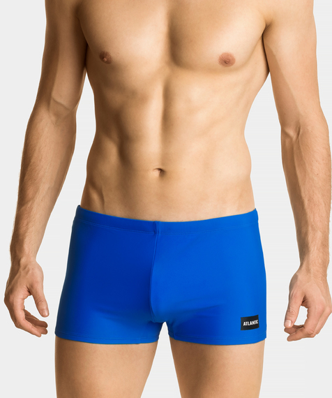 Niebieskie szorty kąpielowe ozdobione są logo marki na lewej nogawce #1